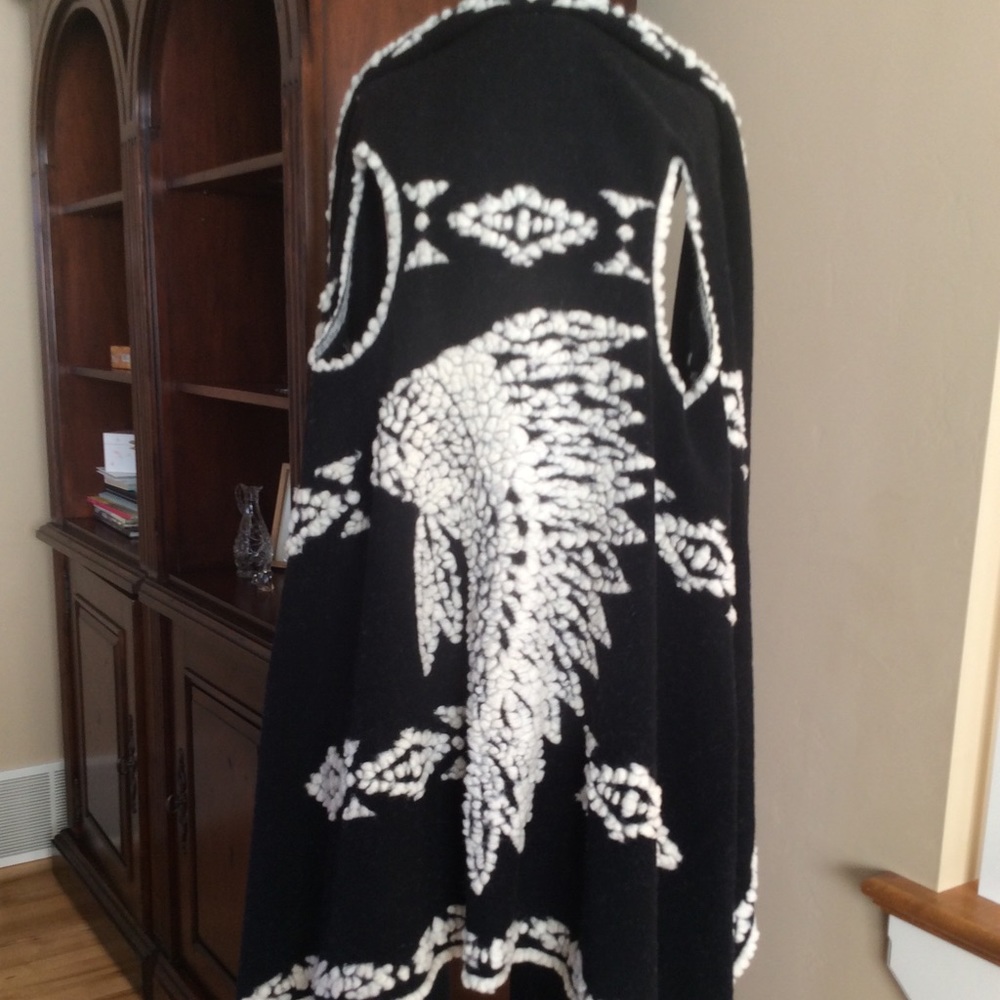 Statement sleeveless draped wrap/cardigan